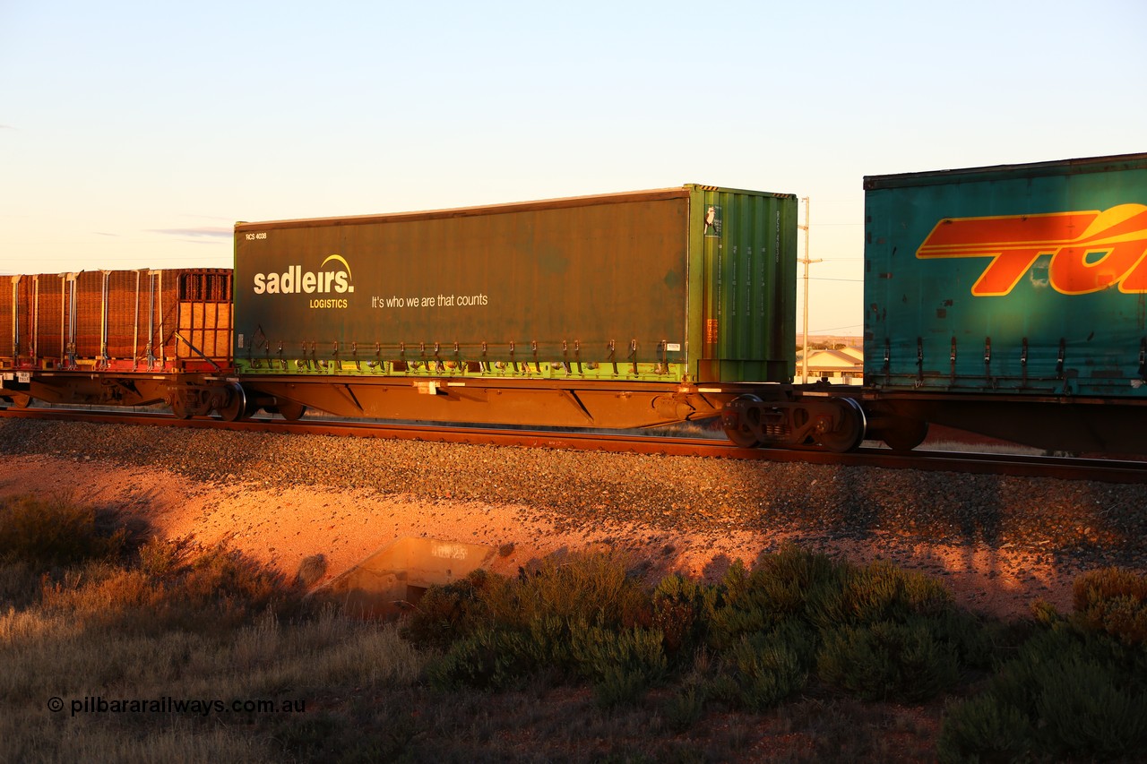 160601 10143
West Kalgoorlie, 2MP5 intermodal train, RRAY 7163 platform 4 of 5-pack articulated skel waggon set, 1 of 100 built by ABB Engineering NSW 1996-2000, 48' deck with a 40' Sadleirs curtainsider RCS 4038
Keywords: RRAY-type;RRAY7163;ABB-Engineering-NSW;