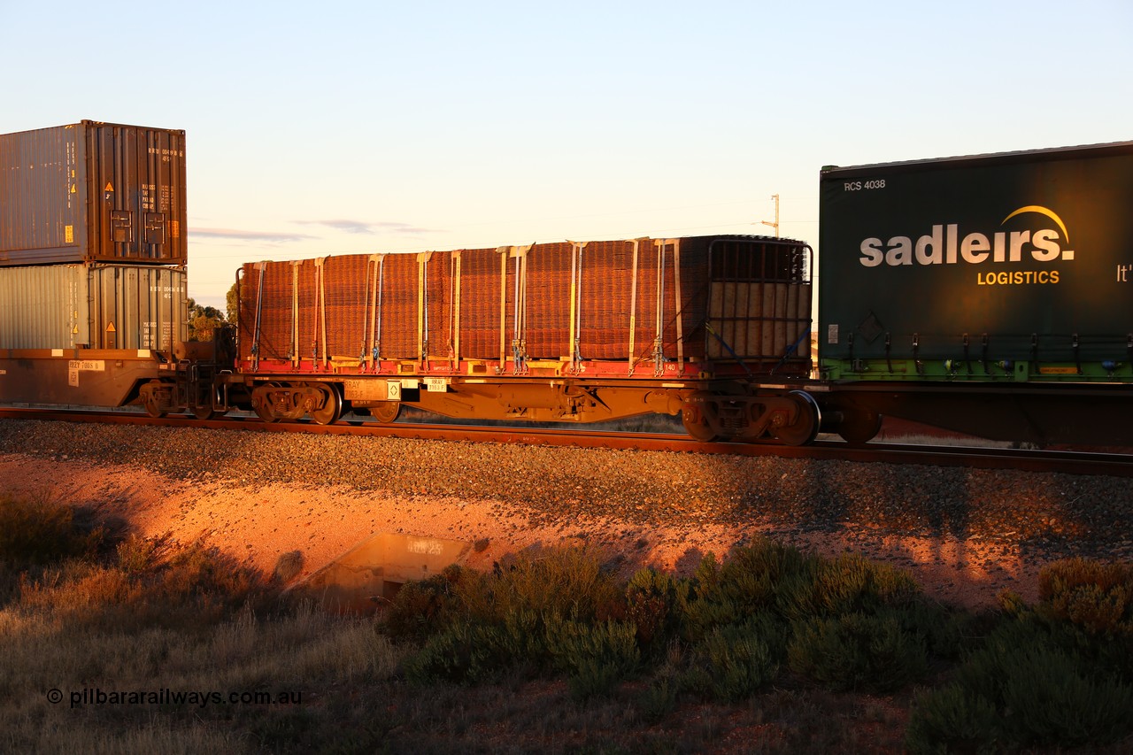 160601 10144
West Kalgoorlie, 2MP5 intermodal train, RRAY 7163 platform 5 of 5-pack articulated skel waggon set, 1 of 100 built by ABB Engineering NSW 1996-2000, 40' deck with a KT 40' flatrack KT 140 loaded with mesh.
Keywords: RRAY-type;RRAY7163;ABB-Engineering-NSW;