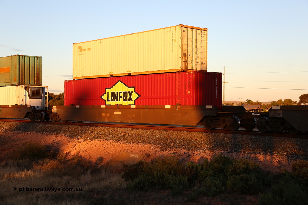 160601 10148
West Kalgoorlie, 2MP5 intermodal train, RRZY 7008 platform 4 of 5-pack well waggon set, the prototype of the RQZY type, first of twenty six sets built by Goninan in 1995-96 for National Rail, later rebuilt and recoded RRZY with a 48' Linfox box FXDU 328062 and a 40' SCF Rail Containers box TSPD 412216 on top.
Keywords: RRZY-type;RRZY7008;Goninan-NSW;RQZY-type;