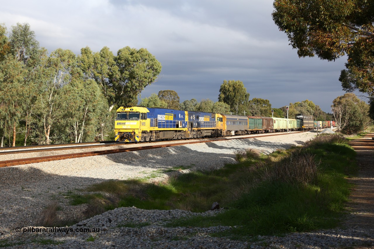 160609 0388
Woodbridge, 5PM5 intermodal train arrives at the triangle and splits signal post 82 and 84 with power from Goninan built GE model Cv40-9i NR class unit NR 35 serial 7250-06/97-237 and a sister unit with 39 waggons for a length of 1791 metres and 3960 tonnes. Behind the crew coach are the Sadleirs louvre vans and an RMEY triple deck articulated car carrying waggon.
Keywords: NR-class;NR35;Goninan;GE;Cv40-9i;7250-06/97-237;