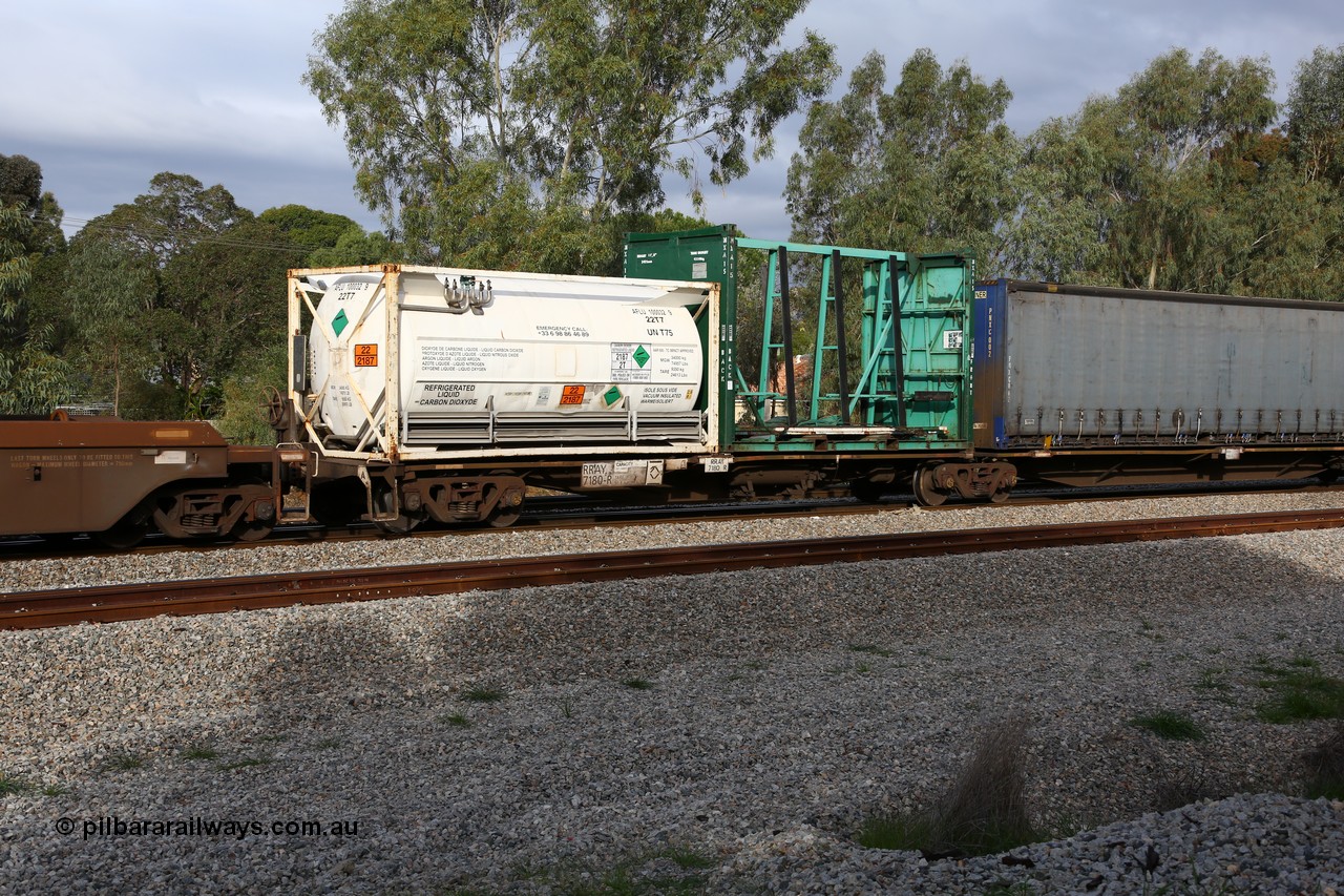 160609 0481
Woodbridge, 5PM5 intermodal train, RRAY 7180 platform 1 of 5-pack articulated skel waggon set, one of a hundred built by ABB Engineering NSW 1996-2000, 40' deck with a 20' Air Liquide WA tanktainer AFLU 100032 and a 20' MAX 15 empty glass grate.
Keywords: RRAY-type;RRAY7180;ABB-Engineering-NSW;