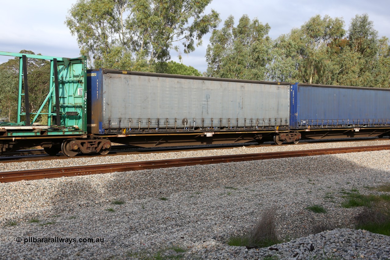 160609 0482
Woodbridge, 5PM5 intermodal train, RRAY 7180 platform 2 of 5-pack articulated skel waggon set, one of a hundred built by ABB Engineering NSW 1996-2000, 48' deck with a Pacific National 48' curtainsider PNXC 002.
Keywords: RRAY-type;RRAY7180;ABB-Engineering-NSW;