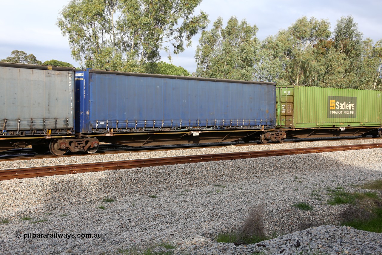 160609 0483
Woodbridge, 5PM5 intermodal train, RRAY 7180 platform 3 of 5-pack articulated skel waggon set, one of a hundred built by ABB Engineering NSW 1996-2000, 48' deck with a Pacific National 48' curtainsider PNXC 4441.
Keywords: RRAY-type;RRAY7180;ABB-Engineering-NSW;