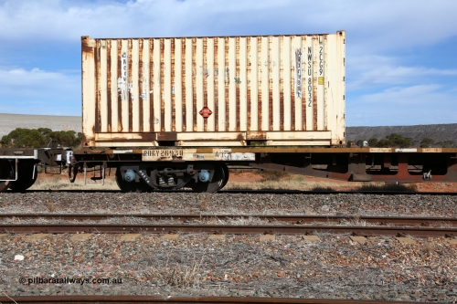 160523 3013
Parkeston, 7SP3 intermodal train, RQKY 2693 container waggon, built by Perry Engineering SA in 1974 in a batch of seventy four RM type motor vehicle flat waggons, converted to AQPY container waggon, then fitted with aligned bogies and recoded to AQMP. April 1994 to RQKY. Side view of code board and aligned bogie with Norwest Shipping 20' 2CG9 type container NWSU 8032.
Keywords: RQKY-type;RQKY2693;Perry-Engineering-SA;RM-type;AQMP-type;