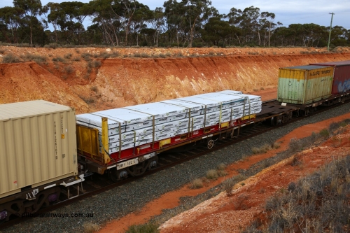 160524 3757
West Kalgoorlie, 2PM6 intermodal train, RQFY 122 container waggon, built by Victorian Railways Bendigo Workshops in 1980 as a batch of seventy five VQFX type skeletal container waggons, recoded in April 1994 RQFY and 2CM bogies fitted August 1995. K+S 40' flatrack loaded over length with Wesbeam products.
Keywords: RQFY-type;RQFY122;Victorian-Railways-Bendigo-WS;VQFX-type;RQFF-type;