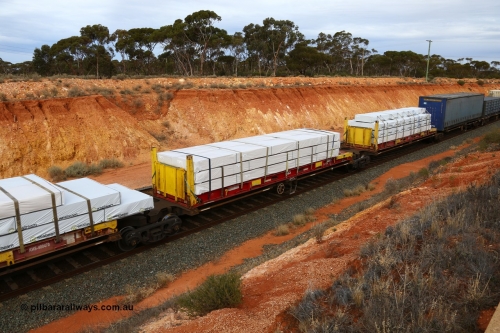 160524 3790
West Kalgoorlie, 2PM6 intermodal train, RRQY 8314 platform 3 of articulated five-unit container waggon set built by Qiqihar Rollingstock Works in China as part of a forty one unit order in 2005/06, K+S 40' flatrack KHS 400824 with Wesbeam products.
Keywords: RRQY-type;RRQY8314;Qiqihar-Rollingstock-Works-China;