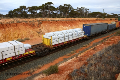 160524 3791
West Kalgoorlie, 2PM6 intermodal train, RRQY 8314 platform 4 of articulated five-unit container waggon set built by Qiqihar Rollingstock Works in China as part of a forty one unit order in 2005/06, K+S 40' flatrack KHS 400647 with Wesbeam products.
Keywords: RRQY-type;RRQY8314;Qiqihar-Rollingstock-Works-China;