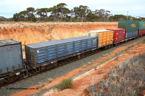 160524 3793
West Kalgoorlie, 2PM6 intermodal train, RQFY 7 container waggon, built by Victorian Railways Bendigo Workshops in April 1978 in a batch of forty QMX type skeletal container waggons, in July 1980 re-coded to VQFX, in October 1994 re-coded to RQFX and 2CM bogies fitted. 40' SCF 40G2 type half height side door container SCFU 200543[0] and 20' Rail Containers 2NG2 type side door container SCFU 310087[5].
Keywords: RQFY-type;RQFY7;Victorian-Railways-Bendigo-WS;QMX-type;