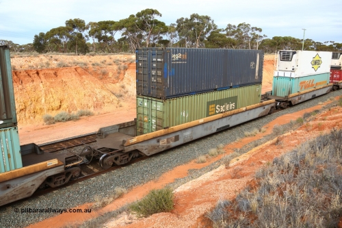 160524 3813
West Kalgoorlie, 2PM6 intermodal train, RQZY 7045 platform 4 of 5-pack well waggon set, one of thirty two sets built by Goninan NSW in 1995-96 for National Rail loaded with a Sadleirs 40' 4EG1 type container RCS 4125 double stacked with Austrans branded Sea2Rail 40' 4EG1 type container SCFU 408055[7].
Keywords: RQZY-type;RQZY7045;Goninan-NSW;