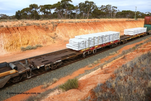 160524 3817
West Kalgoorlie, 2PM6 intermodal train, RQFY 119 container waggon, built by Victorian Railways Bendigo Workshops in 1980 as a batch of seventy five VQFX type skeletal container waggons, recoded to VQFY in 1985, recoded in April 1994 RQFY, May 1995 to RQFF and 2CM bogies fitted August 1995. 40' K+S flatrack KHS 400725 loaded with Wesbeam products.
Keywords: RQFY-type;RQFY119;Victorian-Railways-Bendigo-WS;VQFX-type;VQFY-type;RQFF-type;