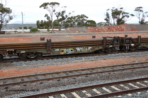 160524 4305
West Kalgoorlie, 1MP2 steel train, RKAX 13, 2-pack rail transport waggon, Platform 2, this waggon was converted by Port Augusta Workshops from two original FBX type waggons built in 1968-69 by Islington Workshops in a batch of twenty later coded AFCX. AFCX 13 & AKAX 5 where the donors for this waggon. Loaded with a full load of rail strings.
Keywords: RKAX-type;RKAX13;SAR-Islington-WS;FBX-type;