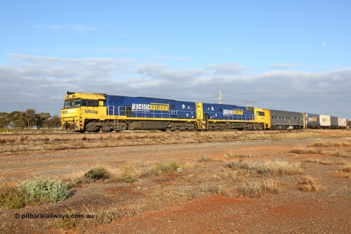 160525 4438
Parkeston, 3PM7 priority service train downgrade over the hill behind Goninan built GE model Cv40-9i NR class units NR 64 serial 7250-11/96-266 and NR 11 serial 7250-02/97-213.
Keywords: NR-class;NR64;Goninan;GE;Cv40-9i;7250-11/96-266;