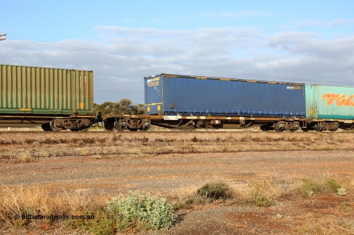 160525 4458
Parkeston, 3PM7 priority service train, RQSY 34975 container waggon, one of a hundred built by Goninan NSW in 1975 as OCY type, recoded to NQOY, with 48' Pacific National curtainsider PNXC 5615.
Keywords: RQSY-type;RQSY34975;Goninan-NSW;OCY-type;NQOY-type;
