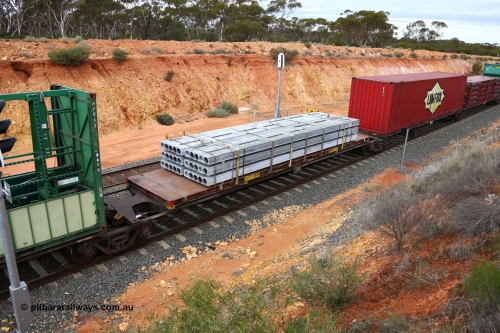 160526 5242
West Kalgoorlie, 4PM6 intermodal train, RRGY 7119 platform 4 of 5-pack articulated skel waggon, one of fifty originally built by AN Rail Islington Workshops in 1996-97 as class RRBY, later rebuilt with 48' intermediate decks and coded RRGY, 48' deck with a 40' KT class flatrack with concrete panels.
Keywords: RRGY-type;RRGY7119;AN-Islington-WS;RRBY-type;