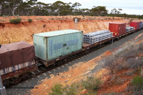 160526 5249
West Kalgoorlie, 4PM6 intermodal train, RQCY 865 container waggon one of a hundred built by Victorian Railways Bendigo Workshops in 1977 as FQX class, recoded to VQCX, in 1994 to RQCX. 20' plain box CCLU 310893 and a 40' KT class flatrack KT 596 with concrete panels.
Keywords: RQCY-type;RQCY865;Victorian-Railways-Bendigo-WS;FQX-type;VQCX-type;