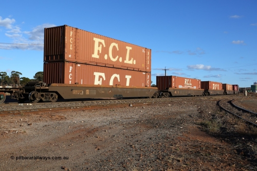 160528 8343
Parkeston, 5SP5 intermodal train, RRZY 7031, originally built by Goninan NSW during 1995/95 as part of thirty four sets of five unit bar coupled well container waggons coded RQZY, recoded to RRZY as repairs were carried out to strengthen them. Loaded with 48' containers, five FCL coded FBCU containers and one Linfox DRC 931. FCL FBGU 480319[3] is double stacked with FBGU 480110[1].
Keywords: RRZY-type;RRZY7031;Goninan-NSW;RQZY-type;