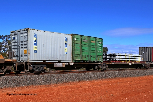 160528 8458
Binduli, intermodal train 6PM6, RRAY 7194 platforms 1 and 2 of 5-pack articulated skeletal waggon set, one of a hundred built by ABB Engineering NSW between 1996-2000, loaded with a 20' Royal Wolf 25G1 type container RWPU 201479[2] and 20' 2PG2 type side door container QLSU 305084[8] on platform 1 and a 40' K&S flatrack KT 118 with concrete panels on platform 2.
Keywords: RRAY-type;RRAY7194;ABB-Engineering-NSW;