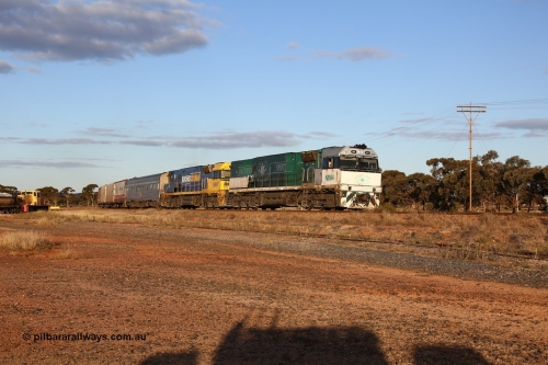 160529 9079
Parkeston, 7MP7 priority service train powers around the curve as it climbs the grade to Kalgoorlie behind a pair of Goninan built GE model Cv40-9i NR class units NR 84 serial 7250-04/97-286 and NR 80 serial 7250-03/97-282. NR 84 wears the Southern Spirit livery and is known as the Minty. Off to the left is Loongana Lime shunt loco DE 49, a former BHP 37 class unit built by Goninan in 1961 based on GE 80 ton switcher, serial 4970-013.
Keywords: NR-class;NR84;NR80;Goninan;GE;Cv40-9i;7250-04/97-286;7250-03/97-282;
