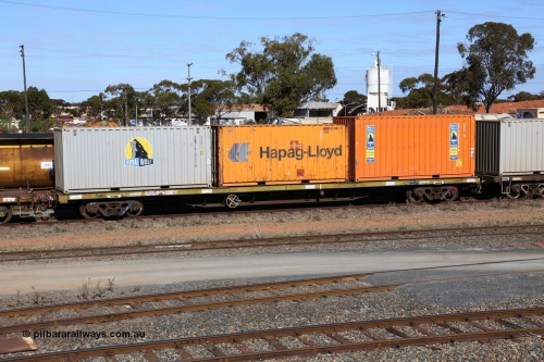 160531 9875
West Kalgoorlie, container waggon RQTY 1 originally built by SAR at Islington Workshops between 1970-72 as part of a batch of seventy two FQX type container waggons. Loaded with three 20' containers, Royal Wolf 22G1 type RWMC 818005, Hapag-Lloyd 22G1 type RSSU 222095 and Royal Wolf 25G1 type RWTU 965926. 31st of May 2016.
Keywords: RQTY-type;RQTY1;SAR-Islington-WS;FQX-type;