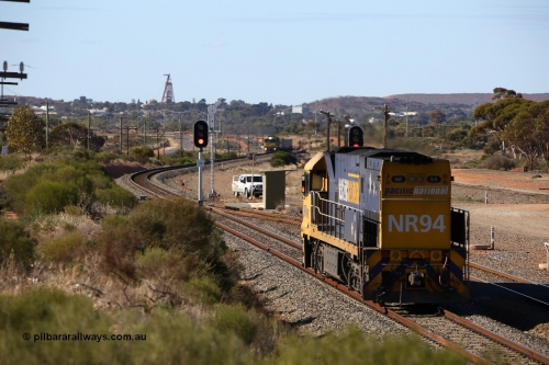 160531 9885
West Kalgoorlie, Pacific National's Goninan built GE model Cv40-9i NR class unit NR 94 serial 7250-06/97-300, shunts off 3PM4 steel train to collect the loading and crew coach sitting in the yard. 31st of May 2016.
Keywords: NR-class;NR94;Goninan;GE;Cv40-9i;7250-06/97-300;
