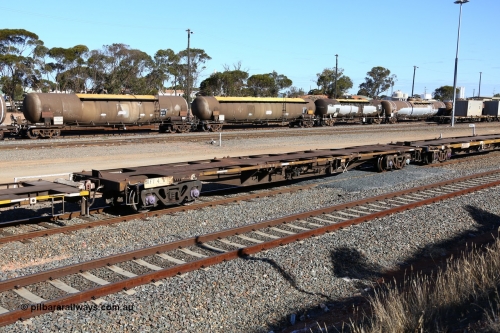 160531 9943
West Kalgoorlie, 3PM4 steel train, empty RQFY 4 container waggon, built by Victorian Railways Bendigo Workshops in April 1978 in a batch of forty QMX type skeletal container waggons, in July 1980 re-coded to VQFX, in October 1994 re-coded to RQFX and 2CM bogies fitted.
Keywords: RQFY-type;RQFY4;Victorian-Railways-Bendigo-WS;QMX-type;