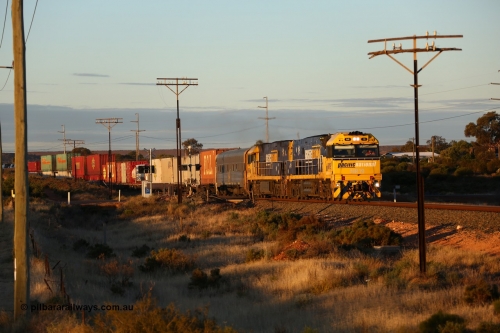 160601 10084
West Kalgoorlie, 2MP5 intermodal service climbs up the grade from Kalgoorlie across Gateacre Road at the 651 km post behind Goninan built GE model Cv40-9i NR class unit NR 19 serial 7250-03/97-221 and a sister unit and 24 waggons for 1464 metres and 3936 tonnes.
Keywords: NR-class;NR19;Goninan;GE;Cv40-9i;7250-03/97-221;