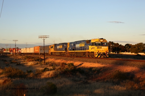 160601 10086
West Kalgoorlie, 2MP5 intermodal service climbs up the grade from Kalgoorlie across Gateacre Road at the 651 km post behind Goninan built GE model Cv40-9i NR class unit NR 19 serial 7250-03/97-221 and a sister unit and 24 waggons for 1464 metres and 3936 tonnes.
Keywords: NR-class;NR19;Goninan;GE;Cv40-9i;7250-03/97-221;