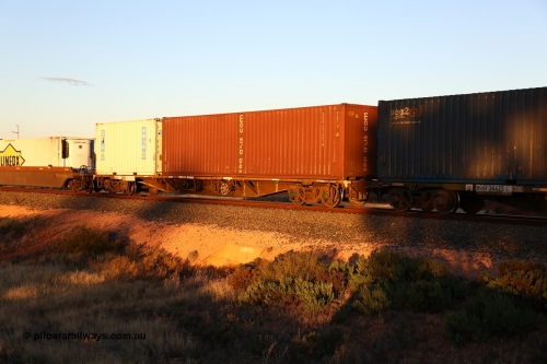 160601 10100
West Kalgoorlie, 2MP5 intermodal train, RQFY 83 container waggon, built by Victorian Railways Bendigo Workshops in 1980 as a batch of seventy five VQFX type skeletal container waggons, recoded to VQFY c1985, then RQFY May 1994, May 1995 to RQFF, then 2CM bogies fitted in Aug 1995 and current code Dec 1995. Axis Intermodal 40' 4EG1 type box SAXU 491062[5] and Royal Wolf 20' 25G1 type box RWTU 963817[8].
Keywords: RQFY-type;RQFY83;Victorian-Railways-Bendigo-WS;VQFX-type;