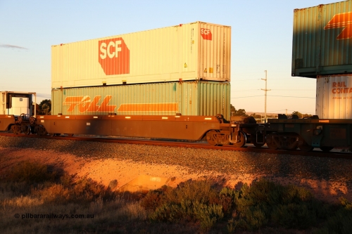 160601 10121
West Kalgoorlie, 2MP5 intermodal train, platform 5 of 5-pack RRRY 7008 well waggon set, one of nineteen built in China at Zhuzhou Rolling Stock Works for Goninan in 2005, double stacked 48' MFG1 type boxes, Toll TDDS 48667 and SCF SCFU 415190[1].
Keywords: RRRY-type;RRRY7008;CSR-Zhuzhou-Rolling-Stock-Works-China;