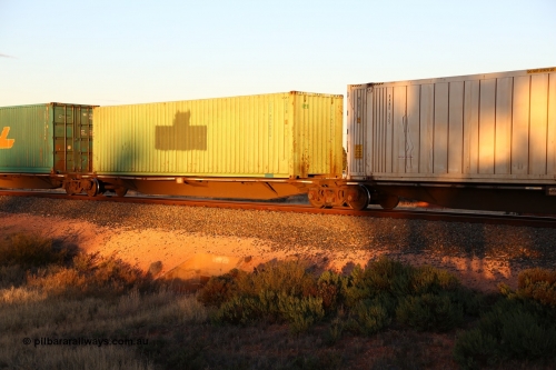 160601 10134
West Kalgoorlie, 2MP5 intermodal train, RRGY 7133 48' platform 3 of 5-pack articulated skel waggon, one of fifty built by AN Rail Islington Workshops in 1996-97 as type RRBY, later rebuilt with 48' intermediate decks and coded RRGY, 40' 4EG1 type green SCF box SCFU 400400[6] with a logo painted out.
Keywords: RRGY-type;RRGY7133;AN-Islington-WS;RRBY-type;