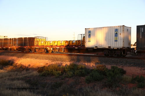 160601 10139
West Kalgoorlie, 2MP5 intermodal train, NQKY 34693 container waggon, originally built by EPT NSW as an open waggon type CDY in a batch of two hundred in 1975/76, recoded to NOCY. 20' Royal Wolf box RWTU 964775[5] and a K&S 40' flatrack KT 400273 loaded with IXOM chlorine gas cylinders.
Keywords: NQKY-type;NQKY34693;EPT-NSW;CDY-type;NOCY-type;