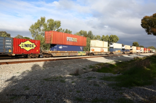 160609 0438
Woodbridge, 5PM5 intermodal train, RQZY 7065 5-pack well waggon set one of thirty two waggon sets built by Goninan NSW for National Rail in 1995-96, showing double stacked loading.
Keywords: RQZY-type;RQZY7065;Goninan-NSW;