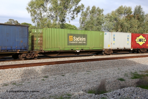 160609 0484
Woodbridge, 5PM5 intermodal train, RRAY 7180 platform 4 of 5-pack articulated skel waggon set, one of a hundred built by ABB Engineering NSW 1996-2000, 48' deck with a Sadleirs 40' 4EG1 type box RCS 4138.
Keywords: RRAY-type;RRAY7180;ABB-Engineering-NSW;