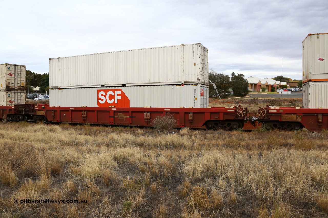 160524 3664
Kalgoorlie, SCT train 2PM9 operating from Perth to Melbourne, PWWY type PWWY 0032 one of forty well waggons built by Bradken NSW for SCT, loaded with a pair of SCF 48' MFG1 type boxes, SCFU 415191 with fresh logo, and SCFU 480474 looking well worn.
Keywords: PWWY-type;PWWY0032;Bradken-NSW;