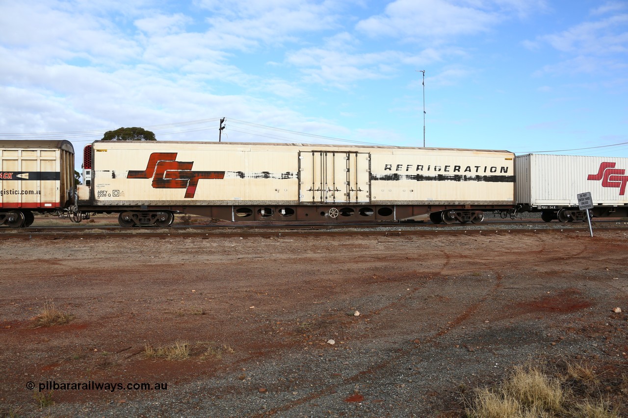 160525 4567
Parkeston, SCT train 3PG1 which operates from Perth to Parkes NSW (Goobang Junction), ARFY type ARFY 2228 refrigerated van with a Ballarat built Maxi-CUBE body mounted on an original Commonwealth Railways ROX container waggon built by Comeng Victoria in 1970, recoded to AFQX, AQOY and RQOY before having the Maxi-CUBE refrigerated body added circa 1998 for SCT service.
Keywords: ARFY-type;ARFY2228;Maxi-Cube;Comeng-Vic;ROX-type;AQOX-type;