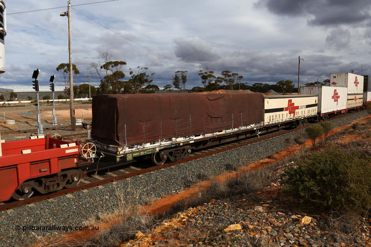 160526 5329
West Kalgoorlie, SCT train 3MP9 operating from Melbourne to Perth, originally built by Victorian Railways Newport Workshops in 1975 as one of twenty five FCF type 'Jumbo' Container Flat waggons built, PQDY 20 still in Freight Australia green livery loaded with a half height 40' former Macfield flat rack MGCU with an SCF tarp and an SCT 40' half height curtainsider.
Keywords: PQDY-type;PQDY20;Victorian-Railways-Newport-WS;FCF-type;FCW-type;VQDW-type;