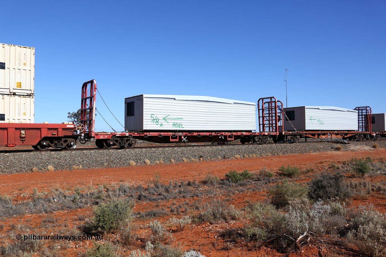 160527 5538
Blamey crossing loop at the 1692 km, SCT train 5PM9 operating from Perth to Melbourne, originally built by Victorian Railways Newport Workshops in 1973 as one of four hundred and fifty five FQX type 60' 3TEU container flat waggons built over ten years, it managed to be recoded several times carrying FQF - VQCX - VQCX - RQCX before private ownership and reclassed PQCY type, PQCY 733 is now fitted with bulkheads and here loaded with a portable building.
Keywords: PQCY-type;PQCY733;Victorian-Railways-Newport-WS;FQX-type;VQCX-type;