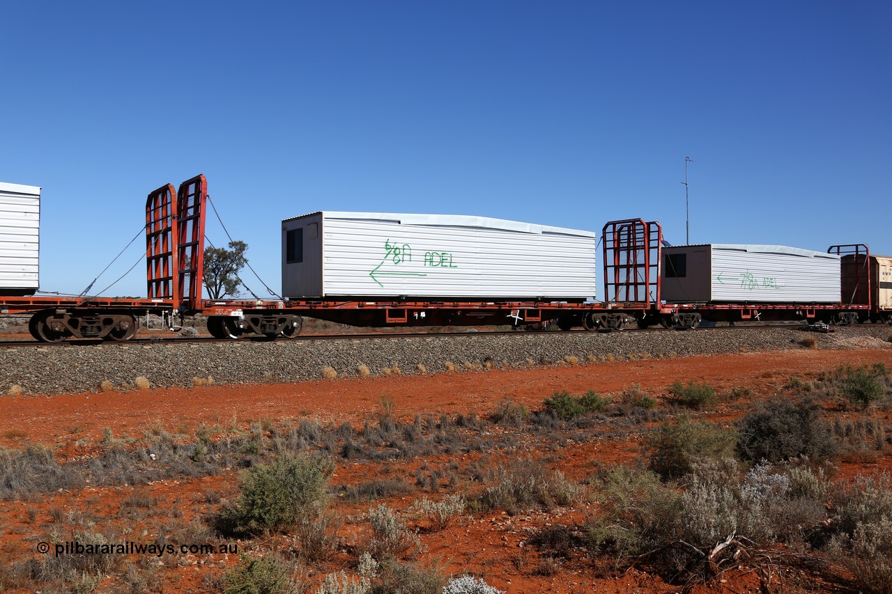 160527 5540
Blamey crossing loop at the 1692 km, SCT train 5PM9 operating from Perth to Melbourne, originally built by Victorian Railways Newport Workshops in 1973 as one of four hundred and fifty five FQX type 60' 3TEU container flat waggons built over ten years, it was recoded to VQCX before private ownership and reclassed PQCY type, PQCY 778 is now fitted with bulkheads and here loaded with a portable building.
Keywords: PQCY-type;PQCY778;Victorian-Railways-Newport-WS;FQX-type;VQCX-type;