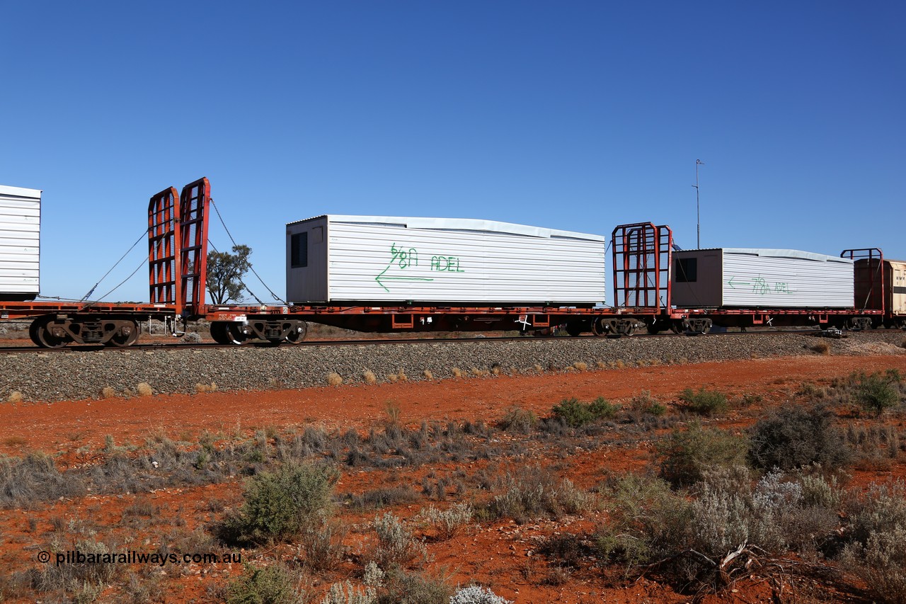 160527 5540
Blamey crossing loop at the 1692 km, SCT train 5PM9 operating from Perth to Melbourne, originally built by Victorian Railways Newport Workshops in 1973 as one of four hundred and fifty five FQX type 60' 3TEU container flat waggons built over ten years, it was recoded to VQCX before private ownership and reclassed PQCY type, PQCY 778 is now fitted with bulkheads and here loaded with a portable building.
Keywords: PQCY-type;PQCY778;Victorian-Railways-Newport-WS;FQX-type;VQCX-type;