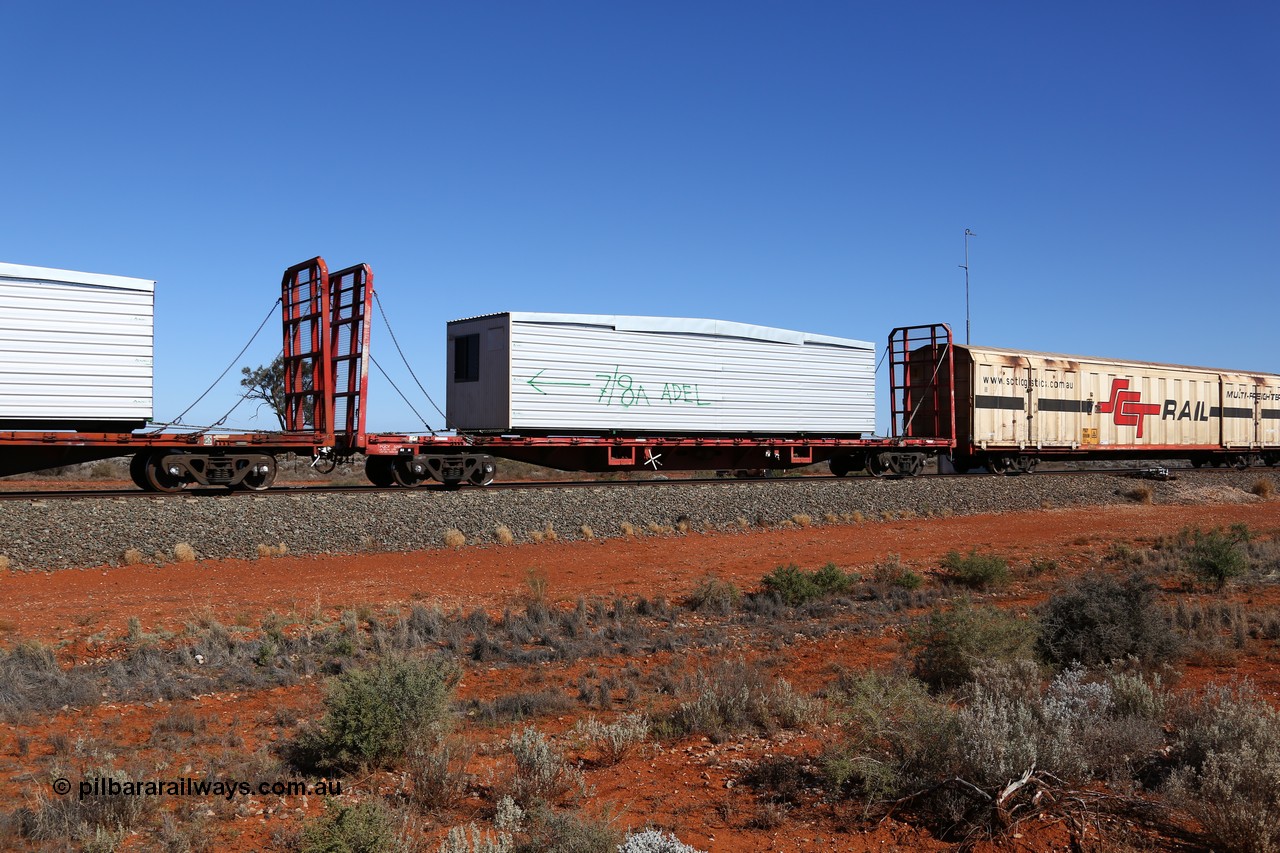 160527 5541
Blamey crossing loop at the 1692 km, SCT train 5PM9 operating from Perth to Melbourne, originally built by Victorian Railways Newport Workshops in 1969 as one of four hundred and fifty five FQX type 60' 3TEU container flat waggons built over ten years, it was recoded to VQCX before private ownership and reclassed PQCY type, PQCY 529 is now fitted with bulkheads and here loaded with a portable building.
Keywords: PQCY-type;PQCY529;Victorian-Railways-Newport-WS;FQX-type;VQCX-type;