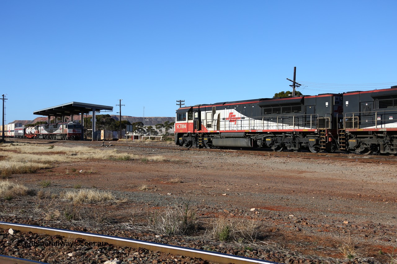 160530 9091
Parkeston, return SCT working 1PM9 led by SCT 004 crosses opposing SCT Perth bound train 7GP1 with SCT 013 on the lead waiting on the mainline. Before SCT introduced these AC traction locomotives the original operations were powered by three of four 3000 hp DC locomotives.
Keywords: SCT-class;SCT004;EDI-Downer;EMD;GT46C-ACe;07-1728;