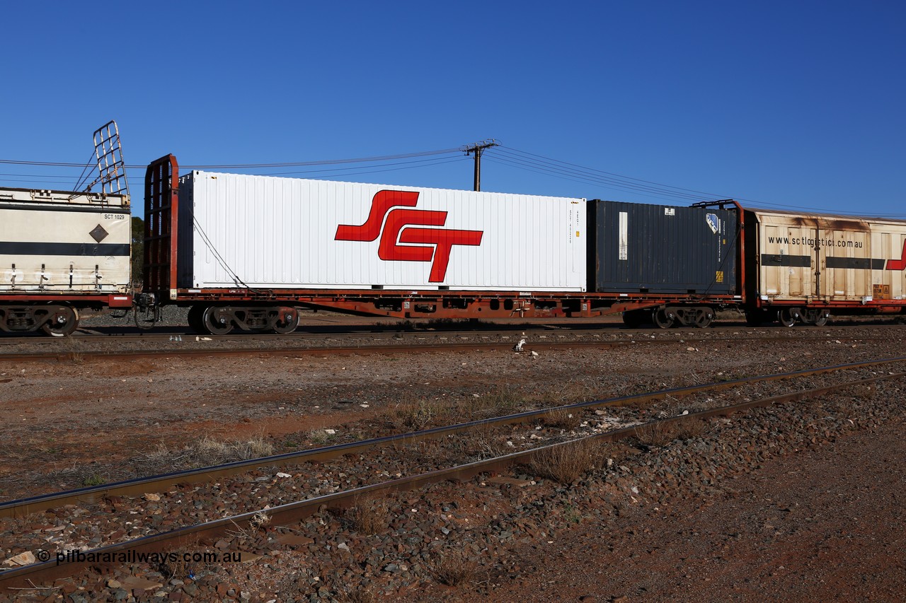 160530 9118
Parkeston, SCT train 1PM9 operates mostly empty from Perth to Melbourne, originally one of one hundred and fifty RMX type container flat waggons built 1975-77 by Perry Engineering SA, recoded through life to AQMX, AQSY, AQMY and RQMY, seen here coded as PQTY type for SCT service as PQTY 4303 and fitted with bulkheads and loaded with SCT 40' 4EG1 type box SCT 40226 and a 20' 2EG1 type CPC box SCFU 203247 with QR National decals.
Keywords: PQTY-type;PQTY4303;Perry-Engineering-SA;RMX-type;