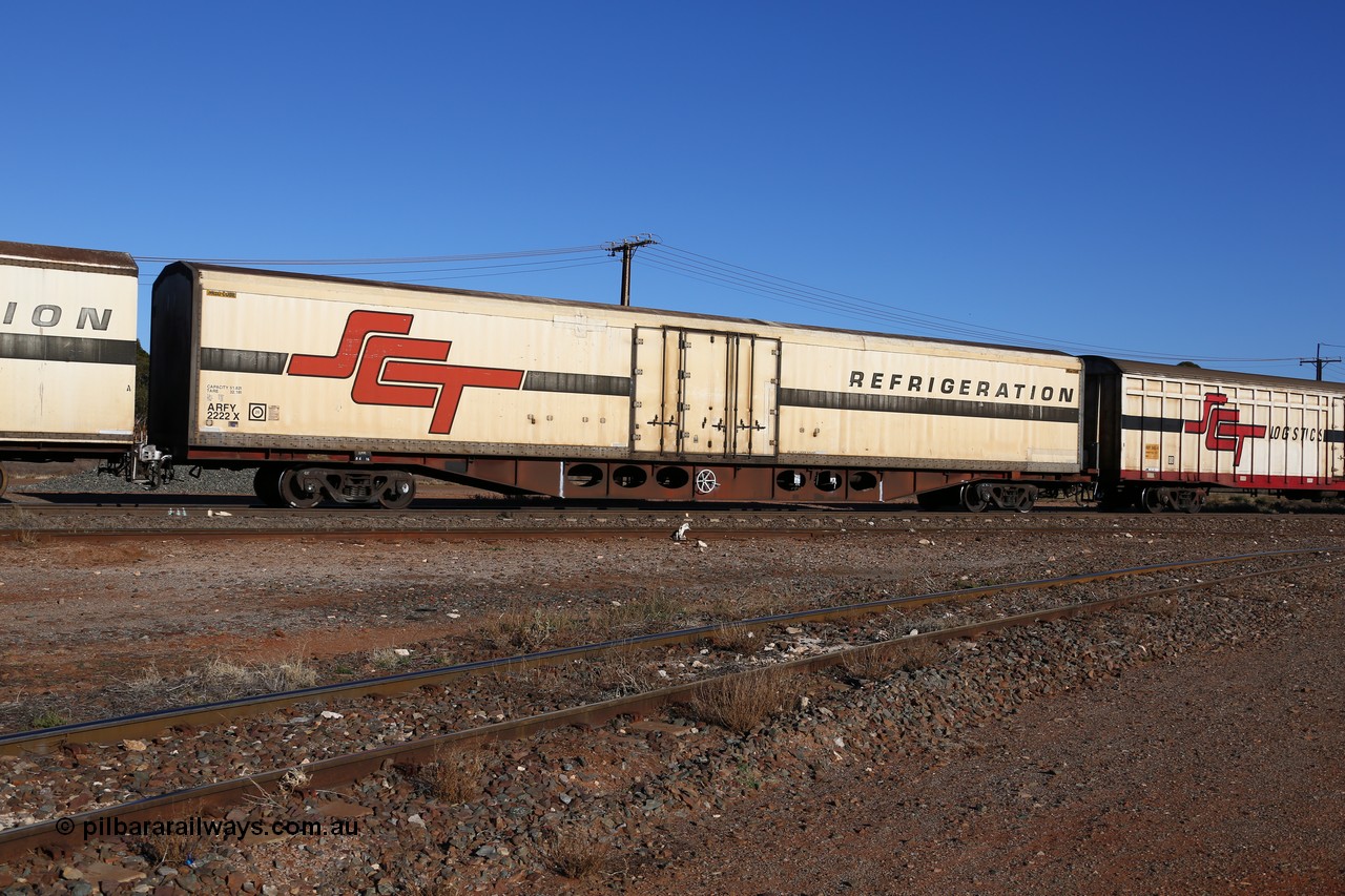 160530 9128
Parkeston, SCT train 1PM9 operates mostly empty from Perth to Melbourne, ARFY type ARFY 2222 refrigerated van with a Ballarat built Maxi-CUBE body mounted on an original Commonwealth Railways ROX container waggon built by Comeng Victoria in 1971, recoded to AQOX and RQOY before having the Maxi-CUBE refrigerated body added circa 1998 for SCT service.
Keywords: ARFY-type;ARFY2222;Maxi-Cube;Comeng-Vic;ROX-type;AQOX-type;