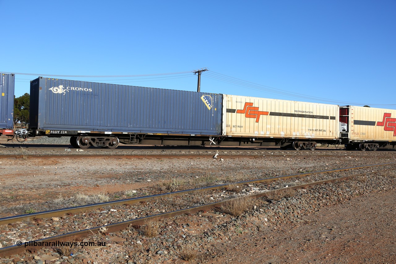 160530 9140
Parkeston, SCT train 1PM9 operates mostly empty from Perth to Melbourne, originally built by Victorian Railways Newport Workshops in 1975 as one of twenty five FCF type 'Jumbo' Container Flat waggons built, PQDY 22 still in Freight Australia green livery loaded with a 40' 4EG1 type Cronos box CXSU 105843 and an SCT 40' reefer SCTR 009 with former code FQRU 402008 visible.
Keywords: PQDY-type;PQDY22;Victorian-Railways-Newport-WS;FCF-type;FCW-type;VQDW-type;