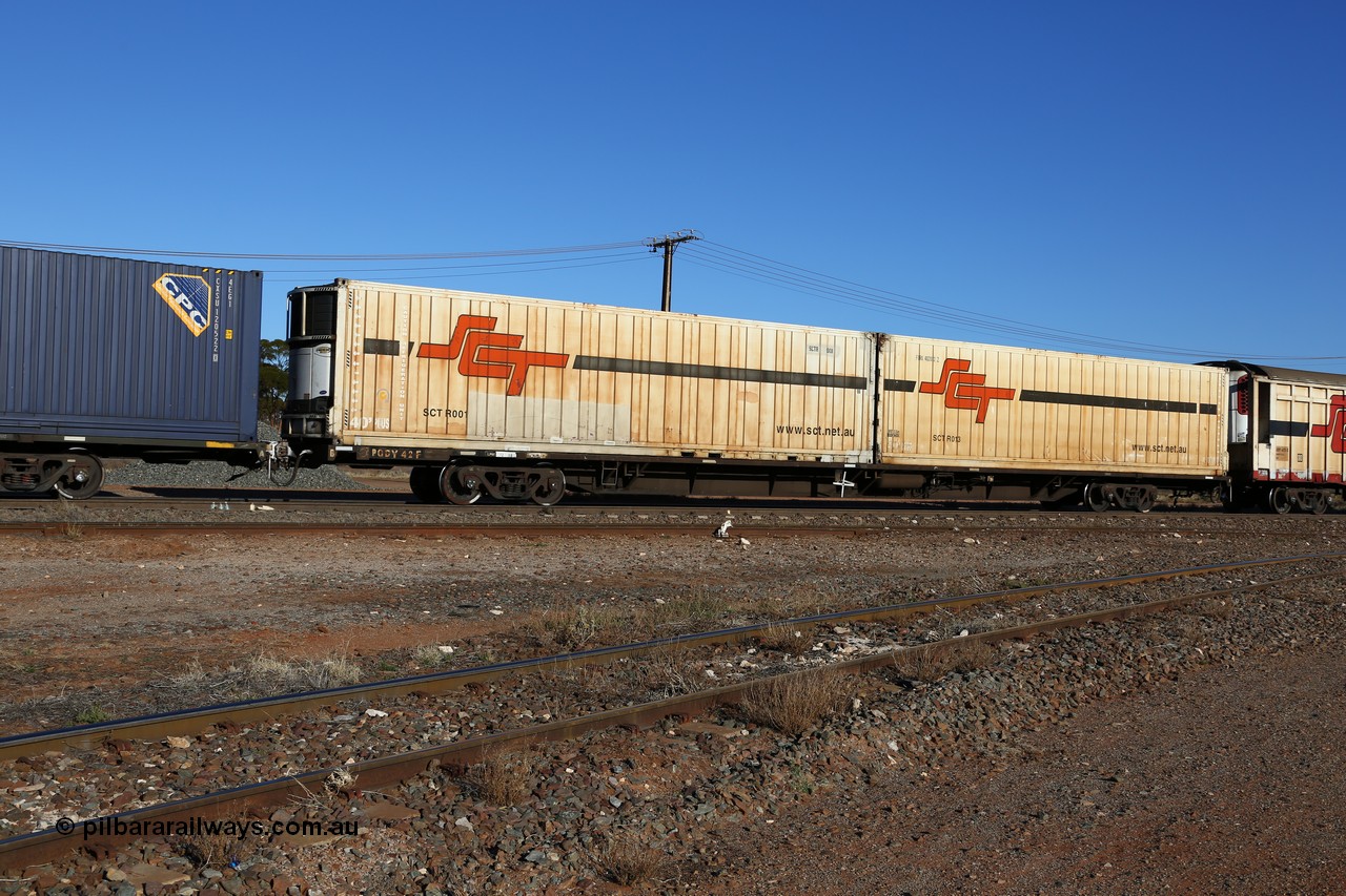 160530 9142
Parkeston, SCT train 1PM9 operates mostly empty from Perth to Melbourne, originally built by Victorian Railways Bendigo Workshops in 1984 as one of fifty VQDW type 'Jumbo' Container Flat waggons built, PQDY 42 still in Freight Australia green livery loaded with a pair of SCT 40' reefers SCTR 001 and SCTR 013 with former code FQRU 402012 visible.
Keywords: PQDY-type;PQDY42;Victorian-Railways-Bendigo-WS;VQDW-type;