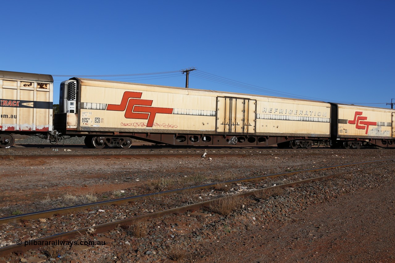 160530 9144
Parkeston, SCT train 1PM9 operates mostly empty from Perth to Melbourne, ARFY type ARFY 2248 refrigerated van with a Ballarat built Maxi-CUBE body mounted on an original Commonwealth Railways ROX container waggon built by Comeng Victoria in 1971, recoded to ROX, RQX, AFQX, AQOY and RQOY before having the Maxi-CUBE refrigerated body added circa 1998 for SCT service.
Keywords: ARFY-type;ARFY2248;Maxi-Cube;Comeng-Vic;ROX-type;AQOX-type;