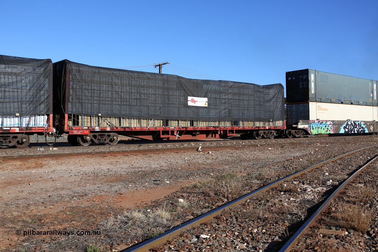 160530 9180
Parkeston, SCT train 7GP1 which operates from Parkes NSW (Goobang Junction) to Perth, originally built by Victorian Railways Newport Workshops in 1969 as one of four hundred and fifty five FQX type 60' 3TEU container flat waggons built over ten years, it was recoded to VQCY before private ownership and reclassed PQCY type, PQCY 551 is now fitted with bulkheads and here loaded with timber products.
Keywords: PQCY-type;PQCY551;Victorian-Railways-Newport-WS;FQX-type;VQCY-type;