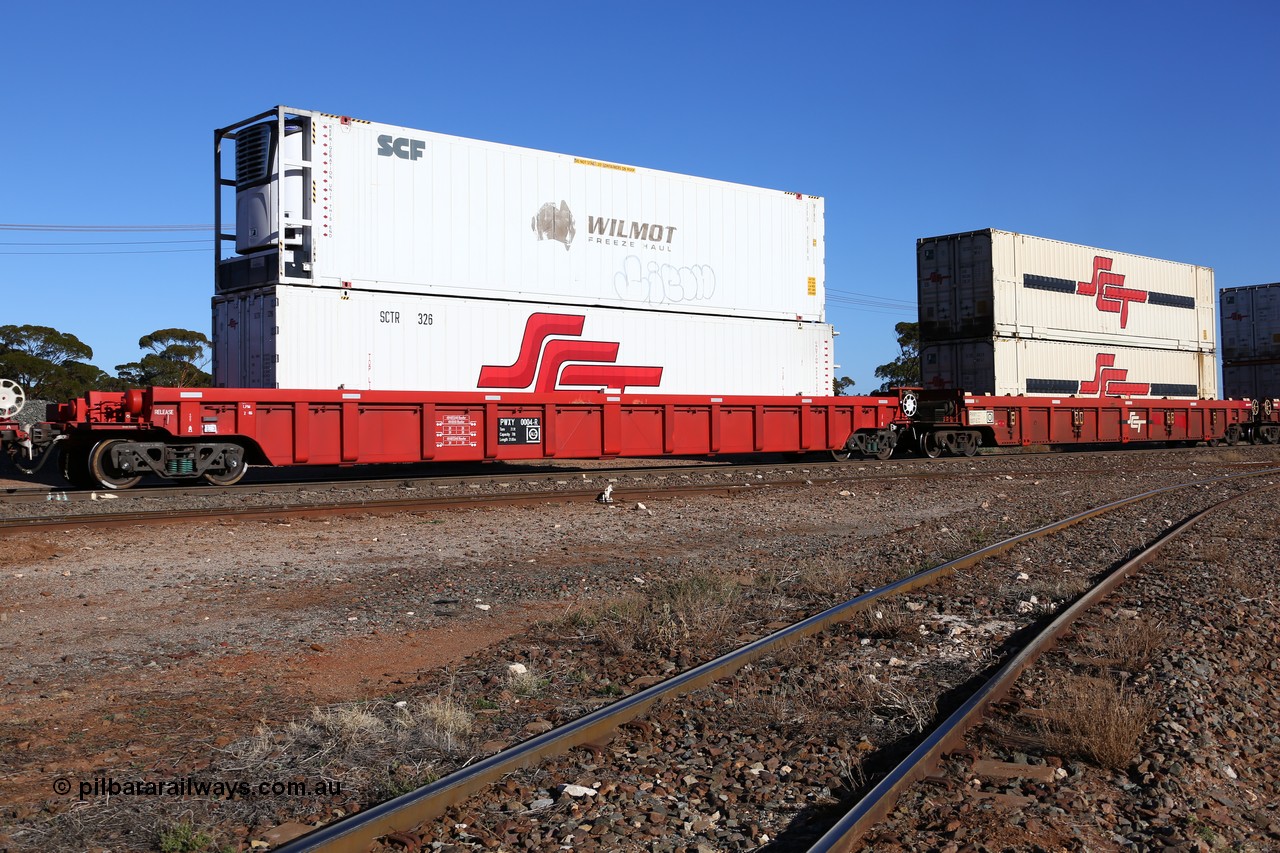 160530 9215
Parkeston, SCT train 7GP1 which operates from Parkes NSW (Goobang Junction) to Perth, PWXY type PWXY 0004 one of twelve well waggons built by CSR Meishan Rolling Stock Co of China for SCT in 2008, loaded with a 48' SCT reefer SCTR 326 and a 46' MFRG type former Wilmot Freeze Haul reefer now with SCF SCFU 814028.
Keywords: PWXY-type;PWXY0004;CSR-Meishan-China;