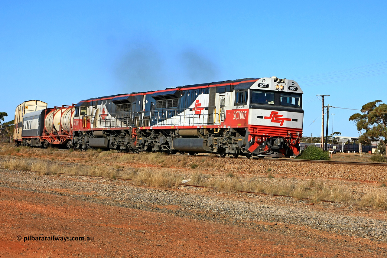 100603 8954
Parkeston, SCT's 3MP9 service operating from Melbourne to Perth with EDI Downer built EMD model GT46C-ACe unit SCT 007 'Geoff (James Bond) Smith' serial 97-1731 leading SCT 002 and 74 waggons for 5674 tonnes and 1782.1 metres in length. 1336 hrs on the 3rd of June 2010.
Keywords: SCT-class;SCT007;07-1731;EDI-Downer;EMD;GT46C-ACe;