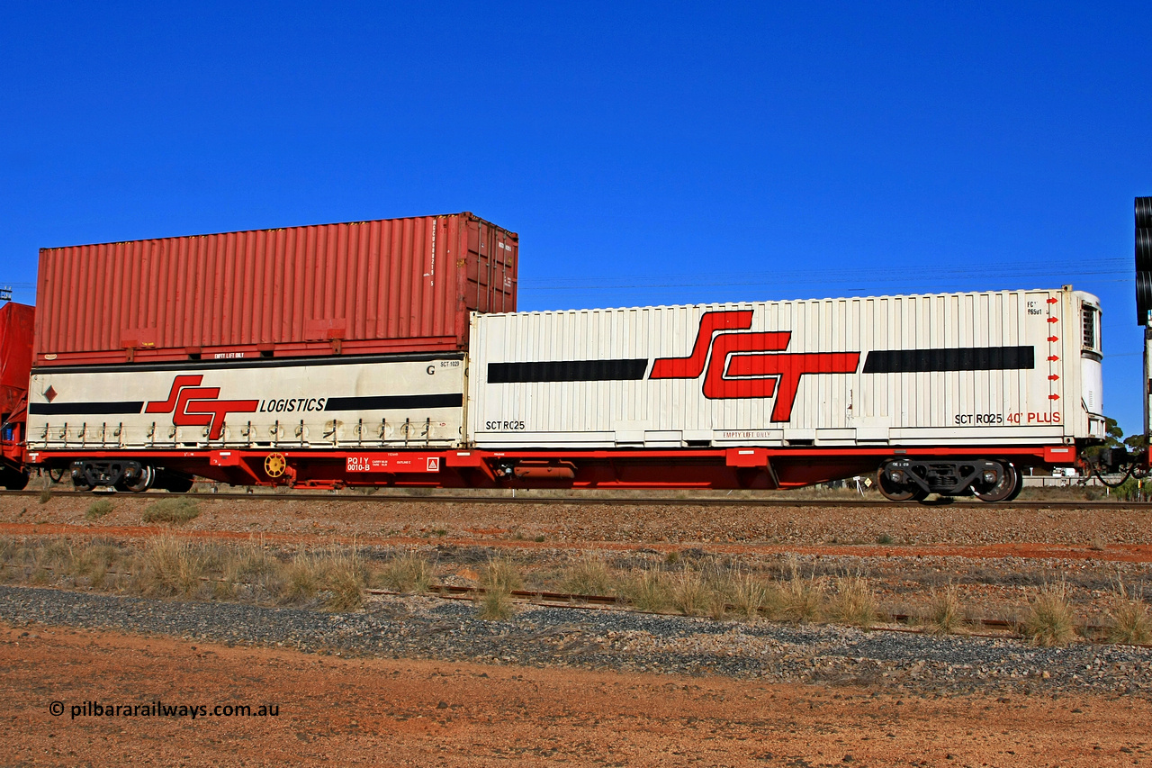 100603 8979
Parkeston, SCT train 3MP9, PQIY type 80' container flat PQIY 0010, one of forty units built by Gemco WA in 2009 loaded with an SCT 40' reefer SCTR 025 [old code FC?? 96501?? visible] and a Macfield 40' box MGCU 600219 [5] [original code 40219 visible] double stacked with an SCT 40' curtain sider SCT 1029.
Keywords: PQIY-type;PQIY0010;Gemco-WA;